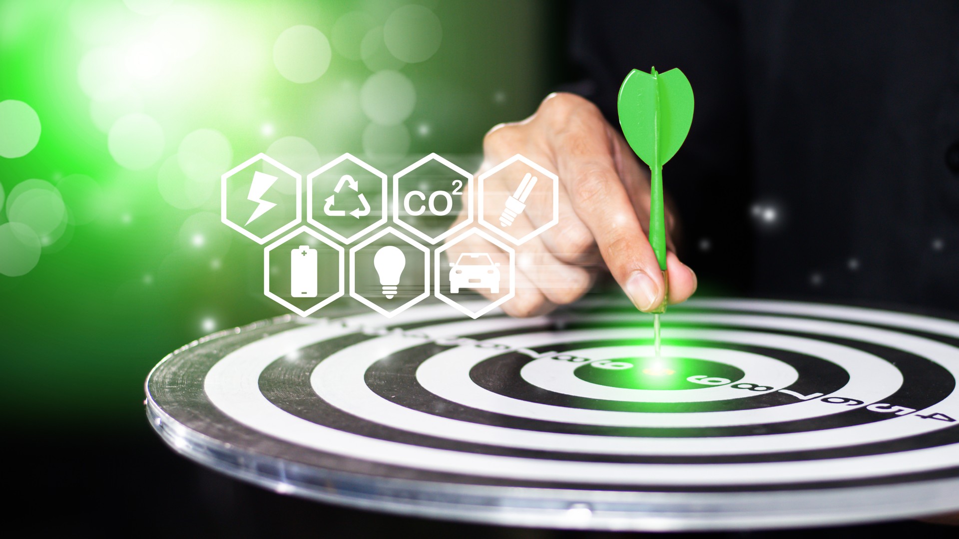 Businessman throwing green arrow dart to  target dart board. ESG environment social governance investment business concept, green business, carbon reduce, social media, financial success